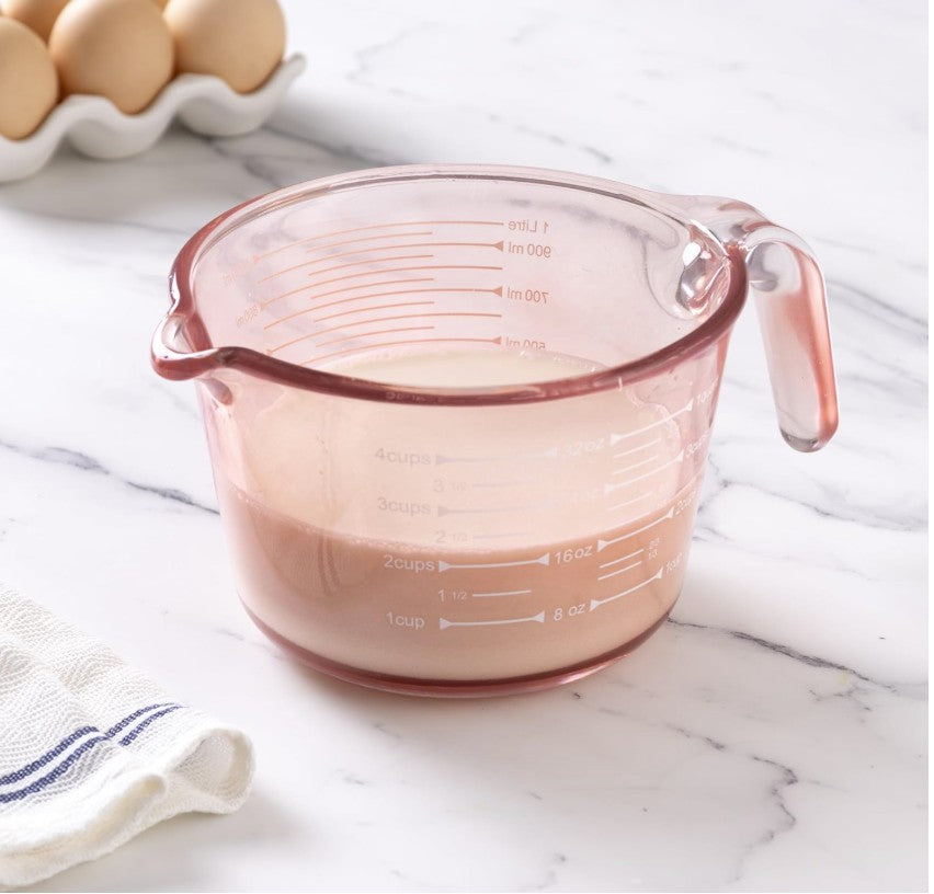 Microwave-safe pink glass measuring cups set, perfect for heating and melting ingredients.