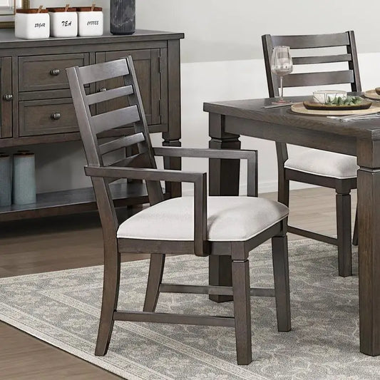 Dining room with wooden table and chairs on a gray rug