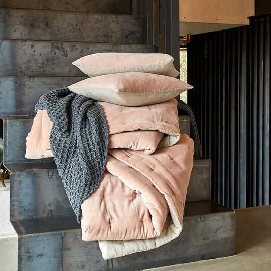 Close-up of the Reversible Luxury Cotton Velvet Throw in Dusky Pink, highlighting the quilted design and luxurious feel of this reversible cotton velvet throw.