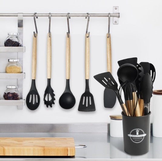 12-Piece Silicone Utensil Set featuring stylish wood handles and holder for organized cooking.