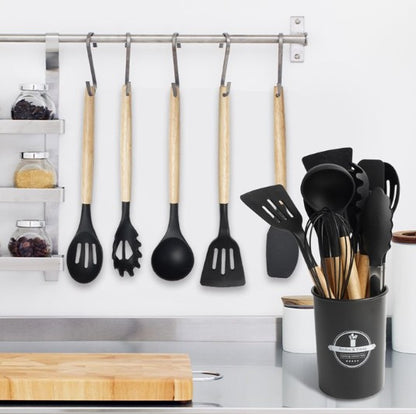 12-Piece Silicone Utensil Set featuring stylish wood handles and holder for organized cooking.