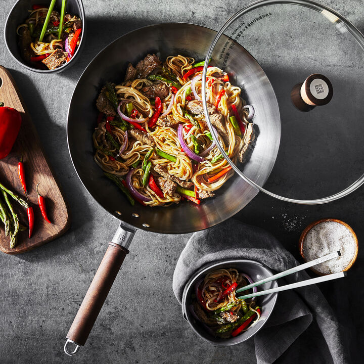 High-quality 12-Inch Carbon Steel Wok perfect for deep-frying and steaming, ideal for restaurant-style meals.