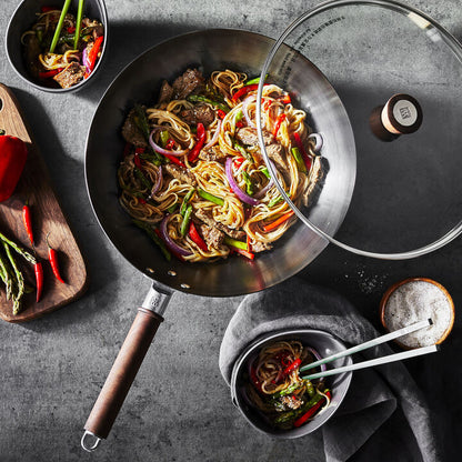 High-quality 12-Inch Carbon Steel Wok perfect for deep-frying and steaming, ideal for restaurant-style meals.