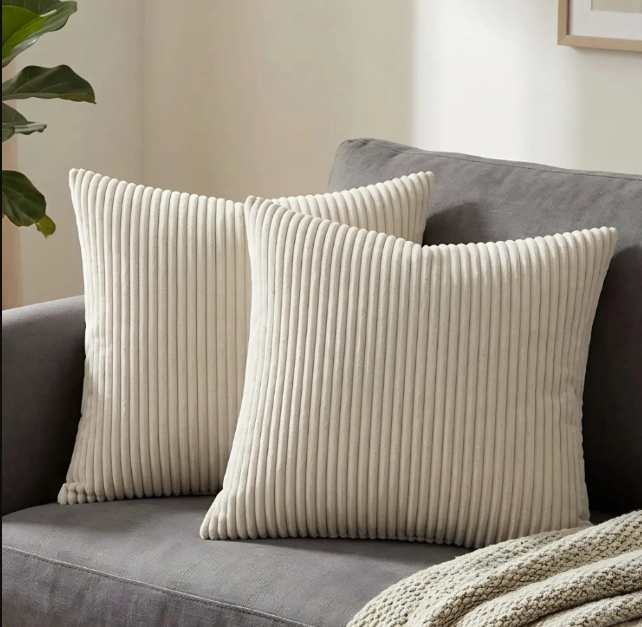 Close-up of cream throw pillow covers showcasing the plush corduroy texture, ideal for adding style and comfort to your home.