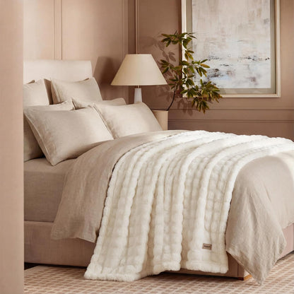 50x60 Off-White 3D Fleece Bubble Throw Blanket styled with neutral pillows and home décor