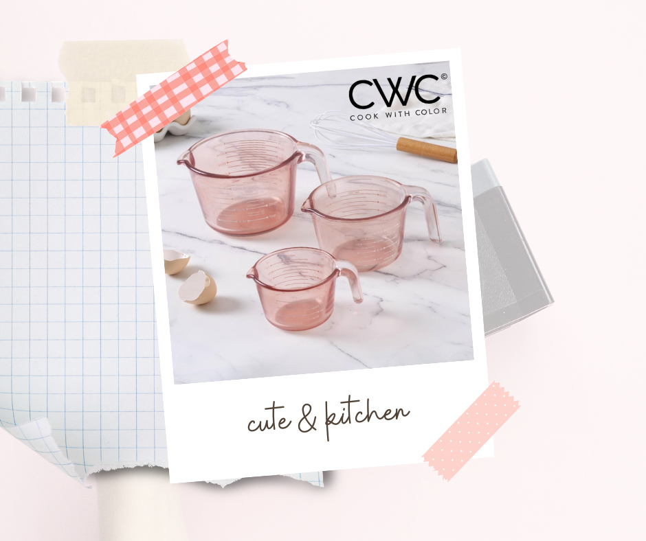 Easy-to-read pink glass measuring cups set sitting beside kitchen utensils, ready for baking.