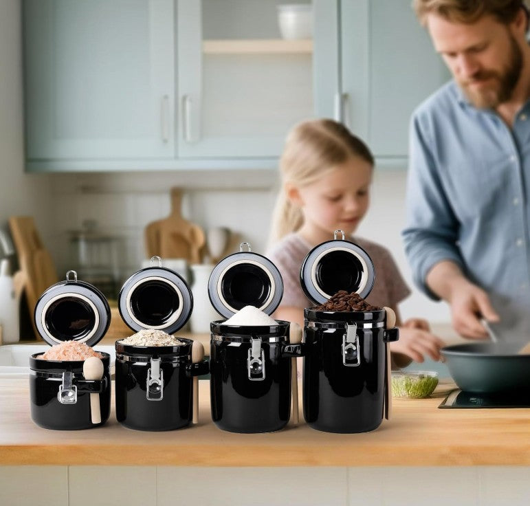 The elegant form of the Luxury Black Ceramic Canister Set with Airtight Seal & Wooden Spoons in a modern kitchen.