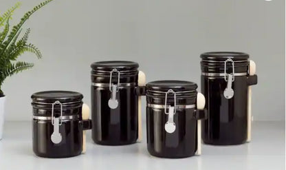 Luxury Black Ceramic Canister Set with Airtight Seal & Wooden Spoons enhancing kitchen aesthetics.