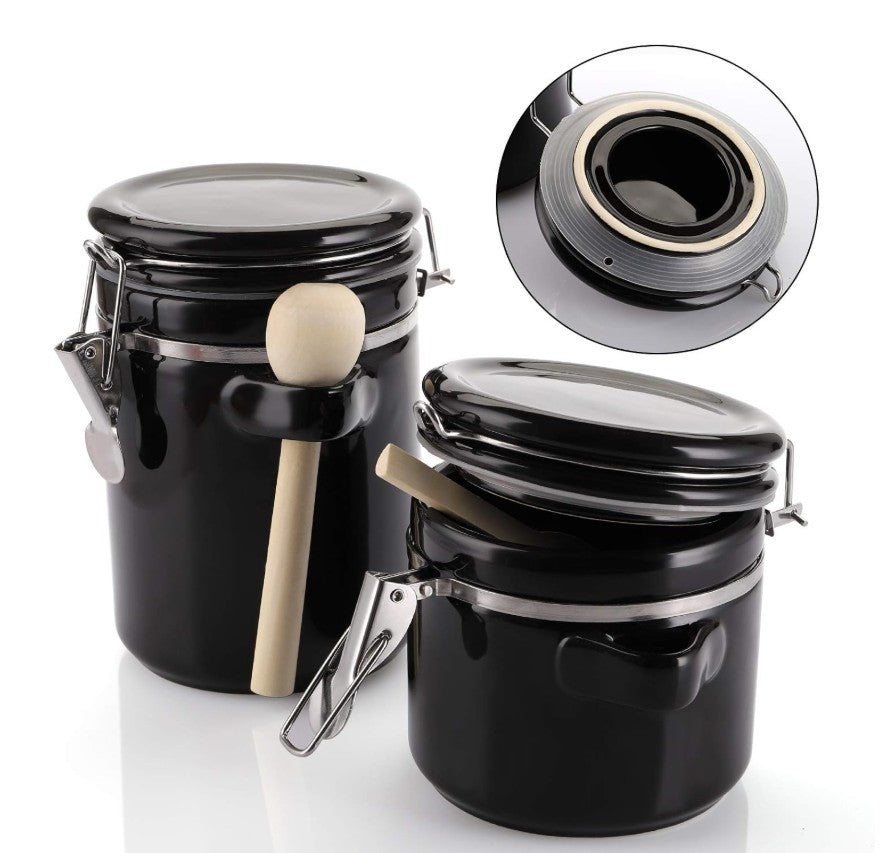Luxury Black Ceramic Canister Set with Airtight Seal & Wooden Spoons styled against a rustic background.