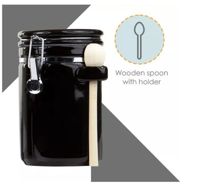 Luxury Black Ceramic Canister Set with Airtight Seal & Wooden Spoons showcased next to food items.