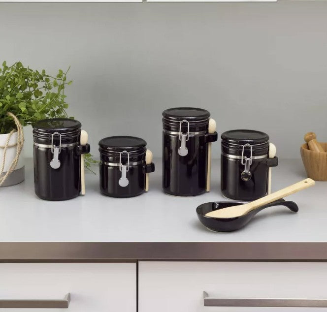 Kitchen organization featuring the Luxury Black Ceramic Canister Set with Airtight Seal & Wooden Spoons on display.
