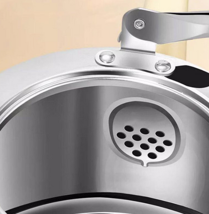 The stainless steel tea kettle on a wooden tray, harmonizing with kitchen decor and enhancing tea time.