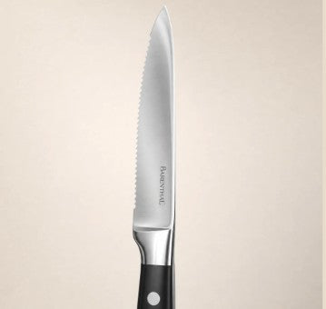 6-Piece German Stainless Steel Serrated Steak Knife Set in brushed stainless steel for a steakhouse-style table