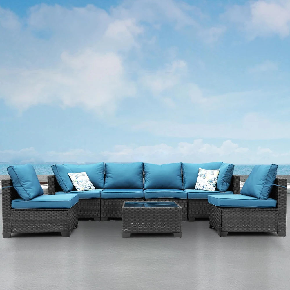 Stylish Modular 7-Piece PE Rattan Wicker Patio Set showcasing customizable layout with plush cushions in outdoor setting.