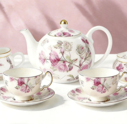 Aynsley 7-Piece Tea Set displayed with fresh flowers, showcasing its beauty and intricate craftsmanship.