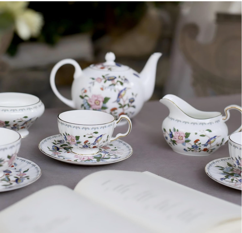 Vibrant and artistic rendition of the Aynsley Tea Set with colorful teacups and floral motifs.