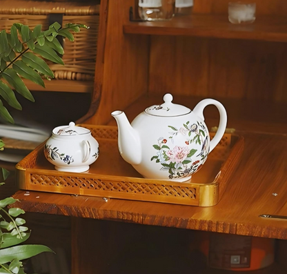 Aynsley Fine Bone China Tea Set elegantly displayed in a picturesque tea serving setting.
