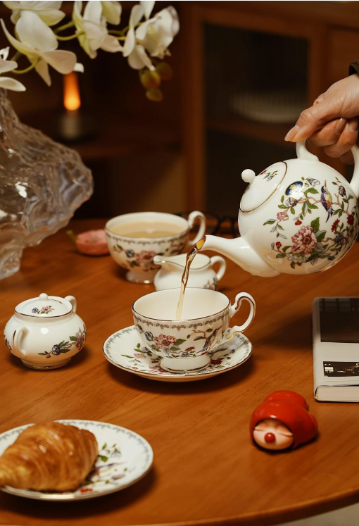 Aynsley Tea Set on a table with delicate pastries, highlighting its perfect pairing for afternoon tea.