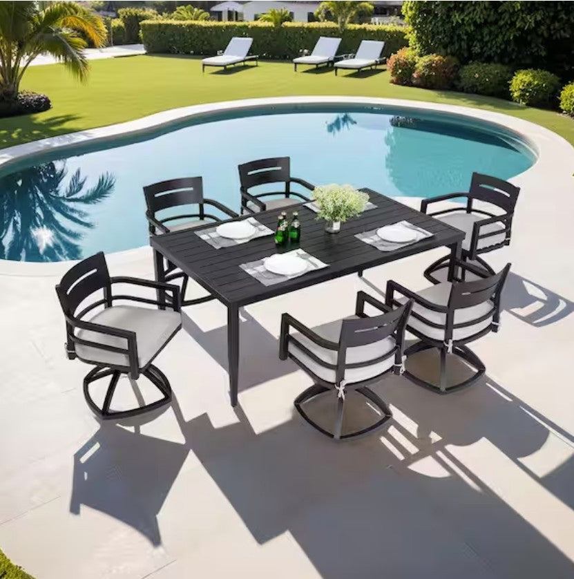A modern outdoor setting featuring the black aluminum dining set ready for guests to enjoy.