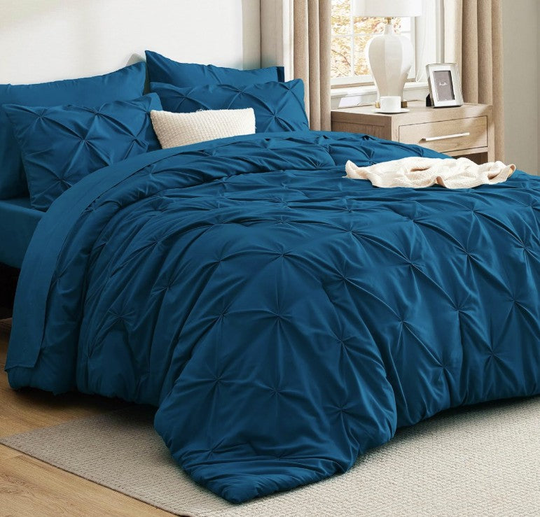 Update your bedroom look effortlessly with the stylish Queen 7-Piece Pintuck Comforter Set, perfect for modern decor lovers.