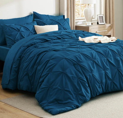 Update your bedroom look effortlessly with the stylish Queen 7-Piece Pintuck Comforter Set, perfect for modern decor lovers.