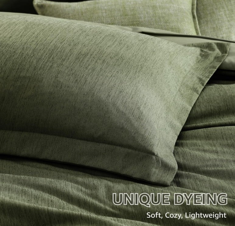 Elegant display of the olive green 7 piece bed in a bag set under soft lighting, enhancing its modern appeal.