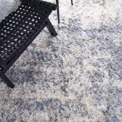 Lifestyle shot of the Luxury Grey Blue Shag Area Rug 9x12 – plush fibers creating a cozy atmosphere in a contemporary living room.