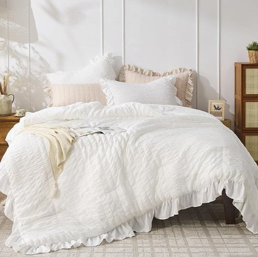 The White Ruffle Comforter Set arranged elegantly, perfect for enhancing modern farmhouse aesthetics.