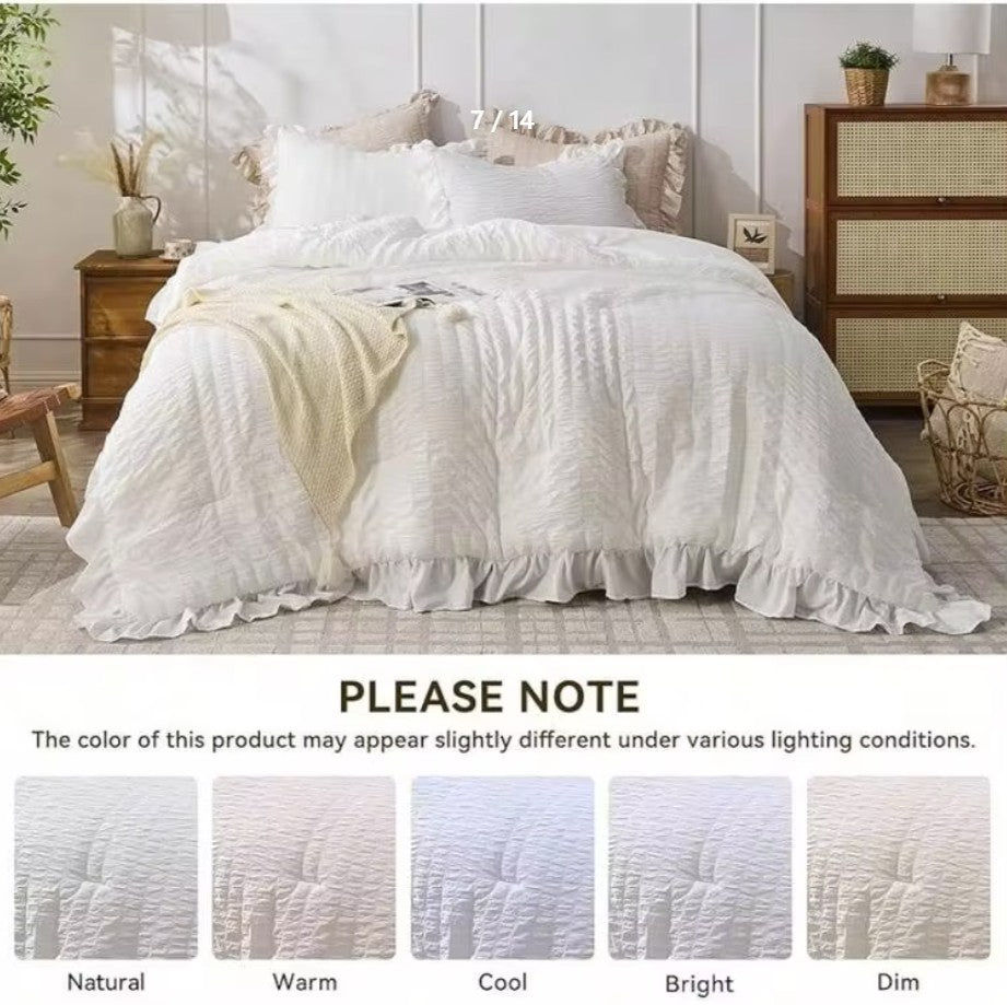 The White Ruffle Comforter Set with pillow shams in a relaxed, inviting bedroom ambiance.