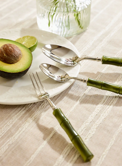 Elegant dining scene featuring the Flatware Set with 18/10 stainless steel cutlery and bamboo-style green handles, perfect for elevating any meal experience.