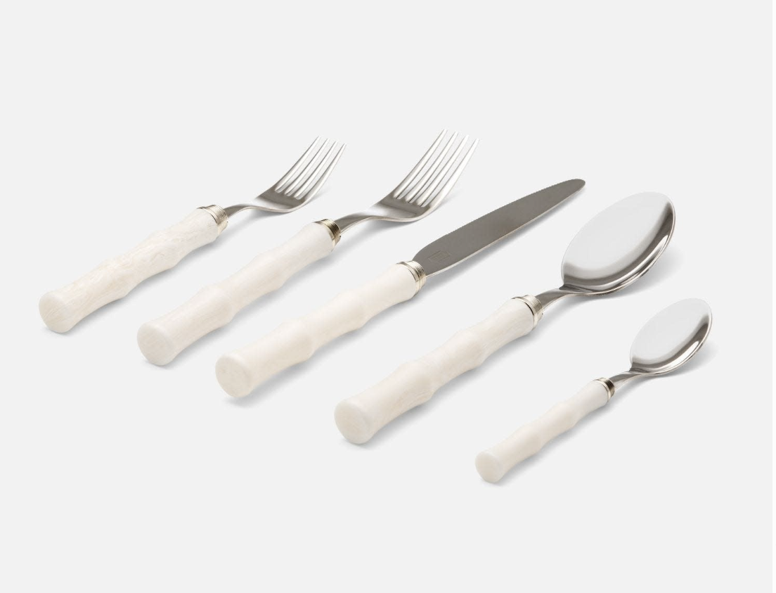 Flatware Set 18/10 Stainless Steel with Bamboo-Style Green Acrylic Handles set near fresh dining arrangements, enhancing the home dining atmosphere with stainless steel cutlery.
