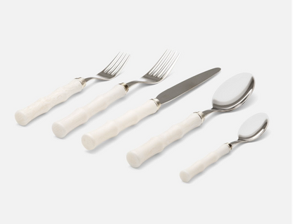 Flatware Set 18/10 Stainless Steel with Bamboo-Style Green Acrylic Handles set near fresh dining arrangements, enhancing the home dining atmosphere with stainless steel cutlery.