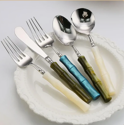 Top view of the Flatware Set featuring 18/10 stainless steel cutlery with vibrant bamboo-style green handles, suitable for both casual meals and formal gatherings.