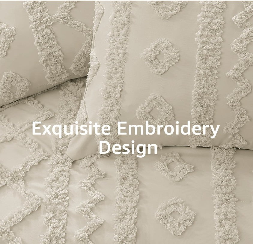 The complete Luxury Tufted Beige Comforter Set folded with its matching pillow shams, perfect for any stylish bedroom.