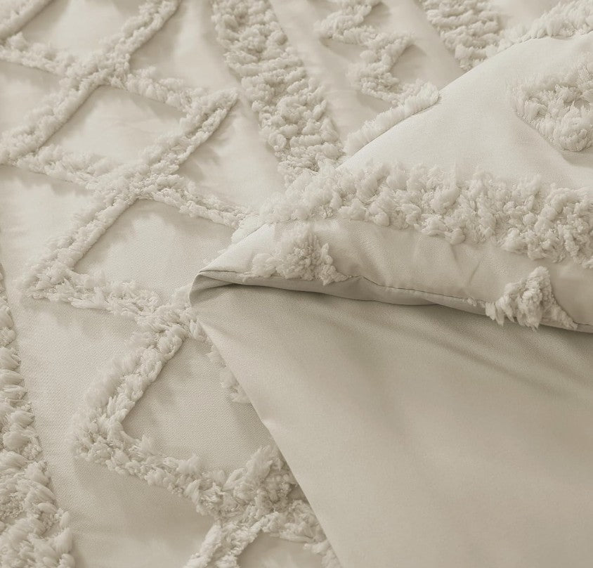 Luxury Tufted Beige Comforter Set including pillows and sheets, highlighting the fullness and comfort of the entire 7 Piece set.