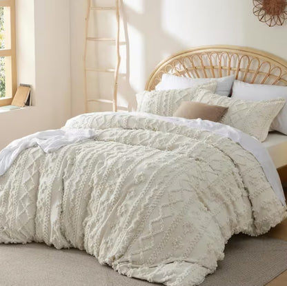 The Luxury Tufted Beige Comforter Set folded neatly to show off its exquisite tufting detail and color.