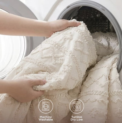 The Luxury Tufted Beige Comforter Set showcased with decorative elements, perfect for a cozy, stylish bedroom.