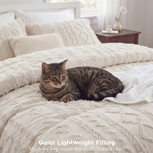 A close-up of the textured fabric of the Luxury Tufted Beige Comforter Set, emphasizing its quality and comfort.