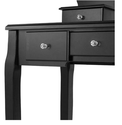 Close-up of the black vanity table showcasing its modern design elements.