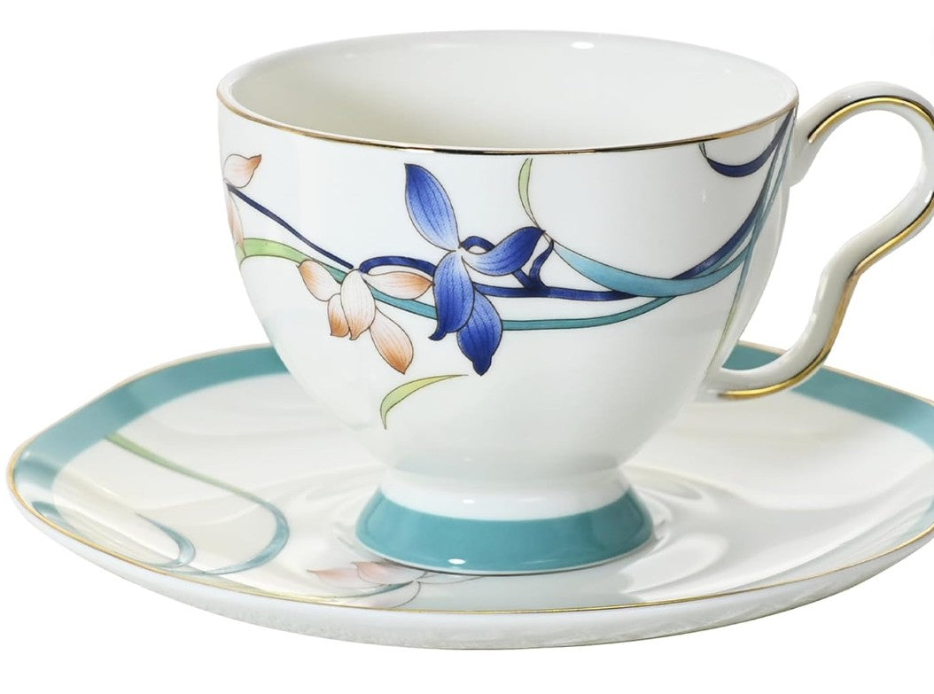 Vintage Bone China Tea Cup and Saucer Set styled with fresh flowers.