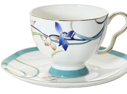Vintage Bone China Tea Cup and Saucer Set styled with fresh flowers.
