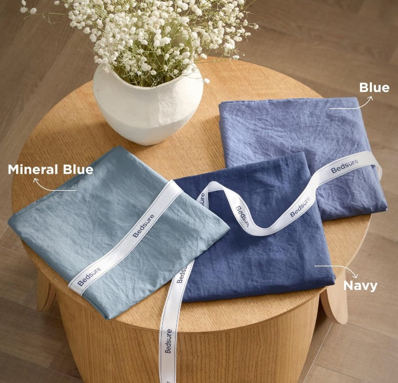 California King Comforter Set – Bed dressed in a complete set for a stylish interior look.