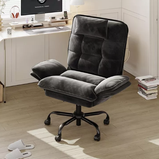 Lifestyle image of a user enjoying comfort in the Velvet Criss Cross Office Chair, an adaptable reclining desk chair.