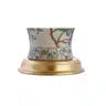 Elegant 24" Multicolor Ceramic Floral LED Table Lamp with Golden Base paired with books on a desk, showcasing its versatility as a multicolor table lamp.