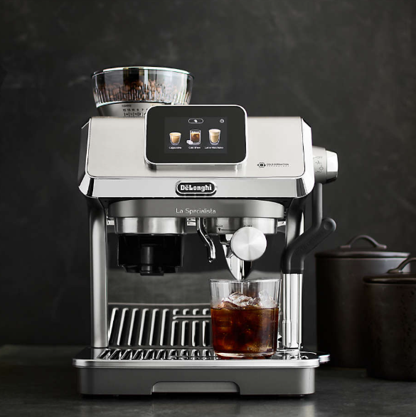 De'Longhi La Specialista Touch Espresso Machine with rich coffee steaming.