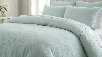 Close-up view of the Full Queen Comforter Set in Light Aqua with intricate jacquard pattern and plush pillow shams.