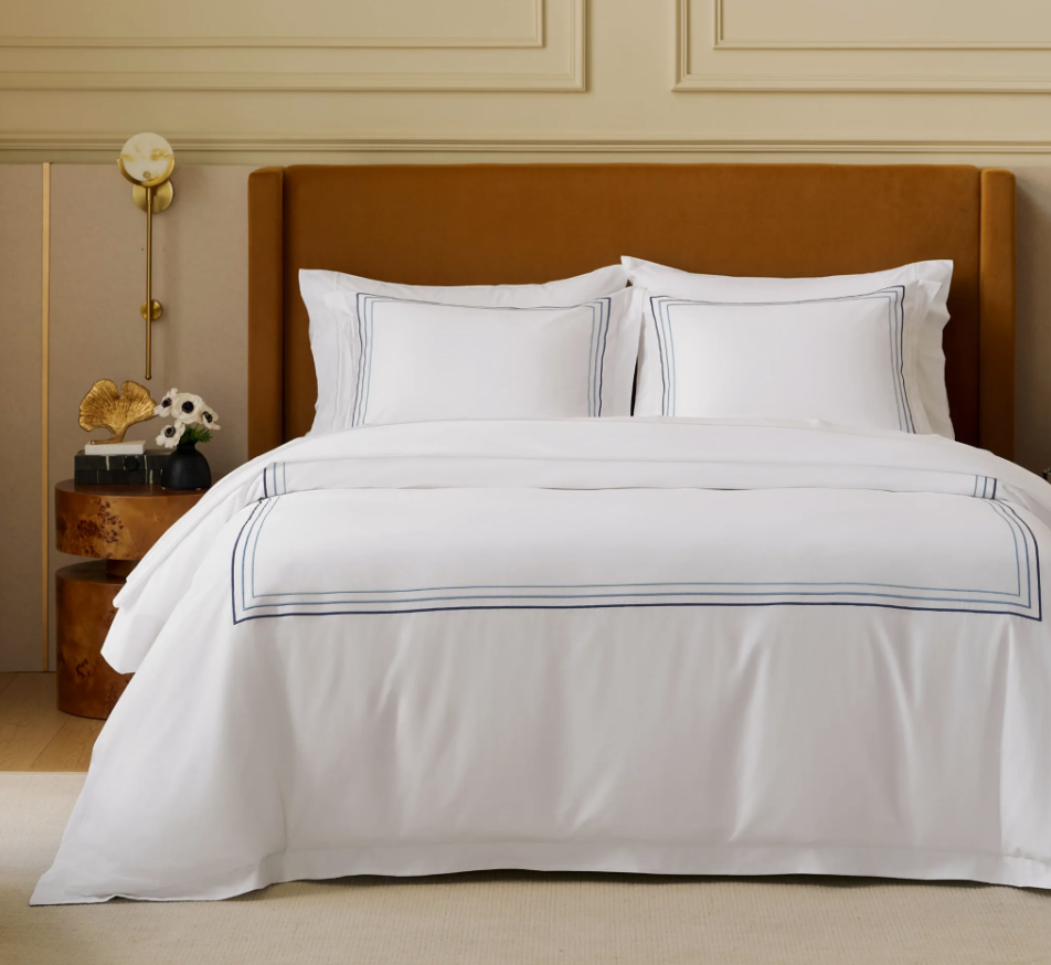 Luxury Duvet Cover Set displayed on a neatly made bed, showcasing its elegant sheen and modern design.