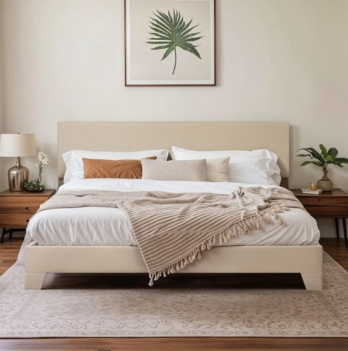 An inviting view of the upholstered platform bed with coordinating bedding and accessories.