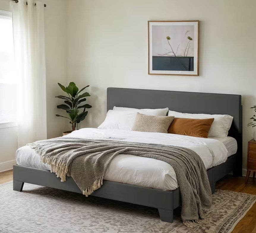 Comfortable and stylish upholstered platform bed paired with neutral bedding and decor.
