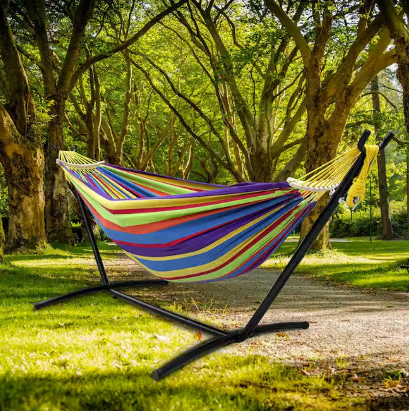 Double Hammock with Stand surrounded by lights – ideal for creating a cozy backyard relaxation hammock atmosphere.